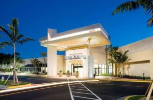 exterior front entrance with parking at night at coral square coral springs florida