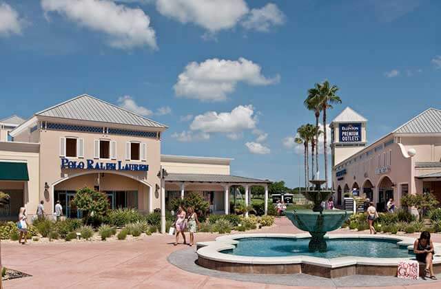exterior plaza with fountain palms and stores at ellenton premium outlets florida