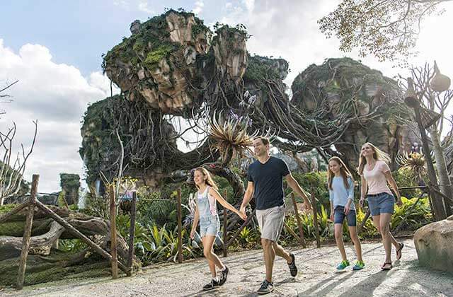 family walking past pandora floating rocks with avatar theme at disneys animal kingdom theme park orlando