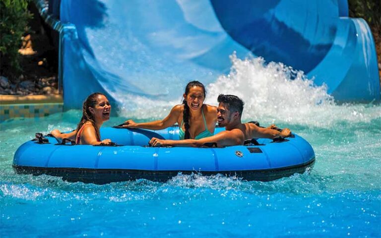 friends in raft at end of slide at aquatica orlando