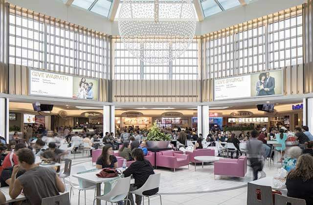 food court inside an atrium with chandelier and shoppers at dadeland mall miami florida