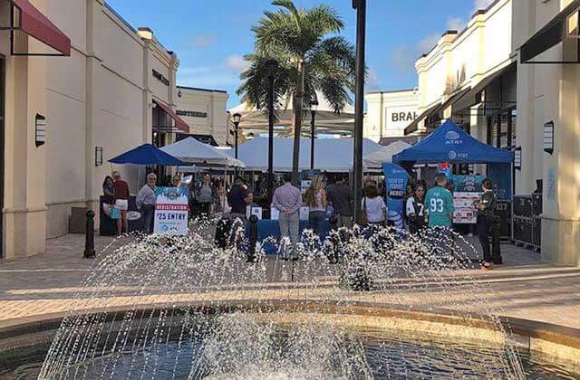 fountain water feature with festival stalls at palm beach outlets west palm beach