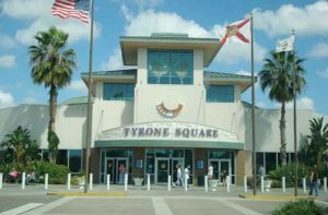front entrance of mall with flags at tyrone square st petersburg