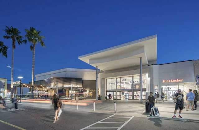 front entrance at night with shoppers at the florida mall orlando