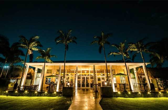 front entrance of the winery with palms and lighting at schnebly redlands winery brewery restaurant homestead