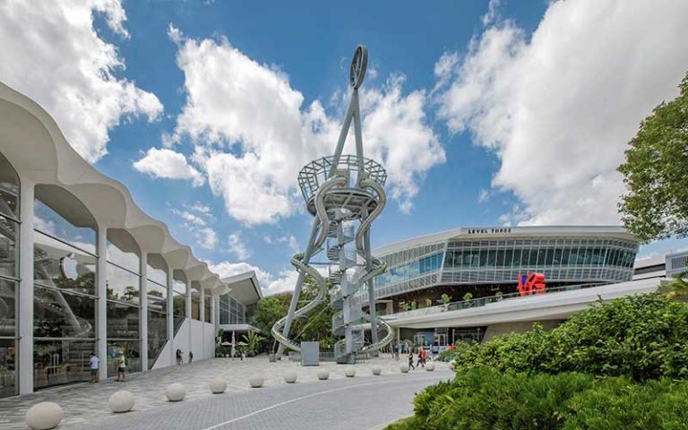 front exterior of mall with metal structure slide at aventura mall miami