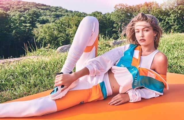 girl stretches on mat with grassy hills at reebok outlets orlando