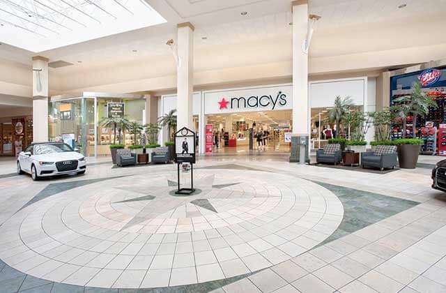 indoor mall area with macys storefront and white audi car at tyrone square st petersburg