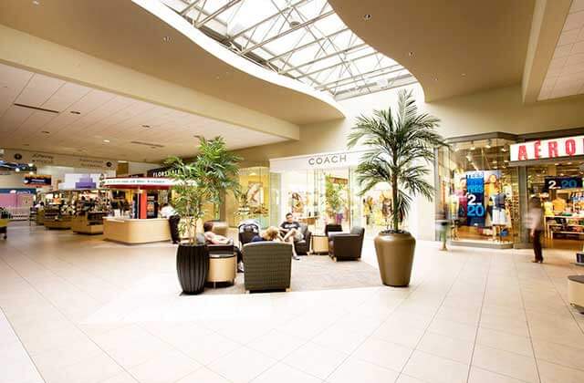 indoor shopping corridor with seating at coral square coral springs florida
