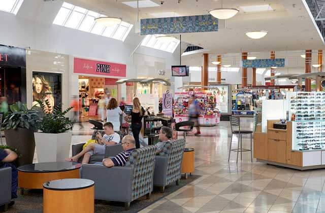 inside shopping corridor with kiosks and seating at miami international mall florida