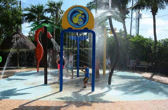 kids play in the splashpad area at dolphin research center marathon