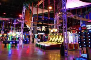 large arcade with games and a ropes course above at xtreme action park ft lauderdale