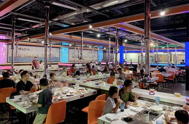 large dining area with hot pot tables at volcano hot pot bbq kissimmee