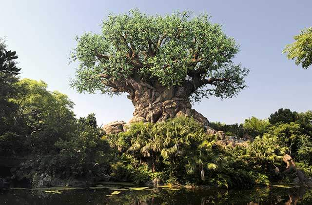 large tree of life sculpture with animal carvings at disneys animal kingdom theme park orlando