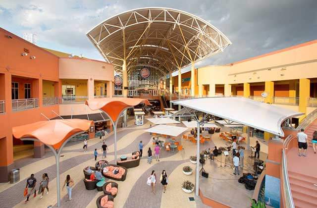 outdoor food court with seating areas and shoppers at dolphin mall miami florida