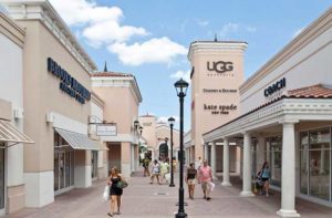 outside shopping center corridor with storefronts at orlando international premium outlets florida