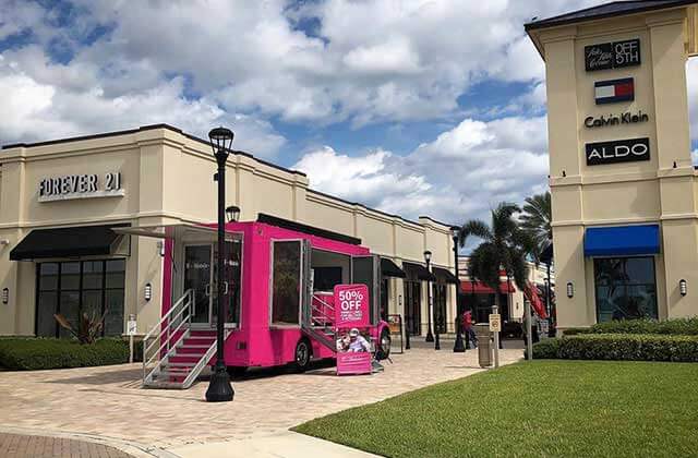 pink mobile kiosk between stores at palm beach outlets west palm beach