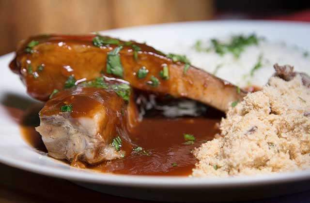 pork cutlet dish with brown gravy and rice at tonys brazilian grill orlando