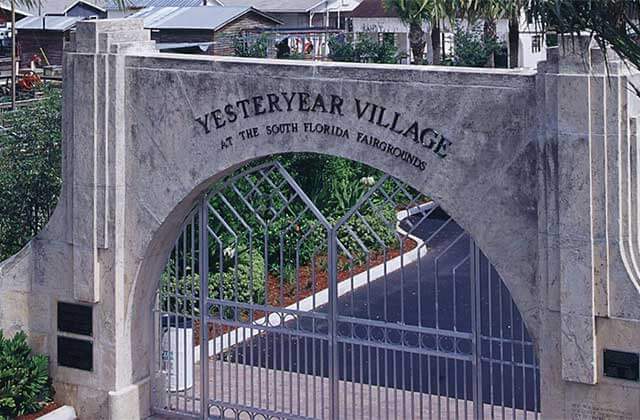 stone pillar archway and gate at yesteryear village west palm beach