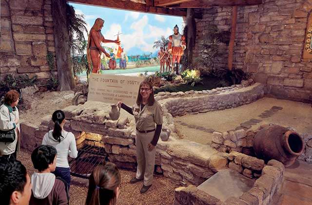 tour guide speaks to kids with native american diorama at ponce de leons fountain of youth st augustine