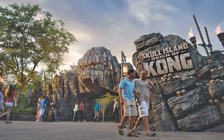 two men walking past skull island sign at universal islands of adventure orlando