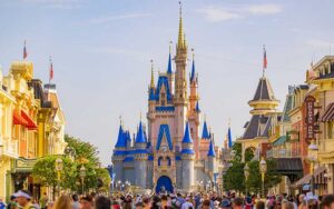 view of cinderella castle from main street area with crowds in daytime at magic kingdom walt disney world resort orlando