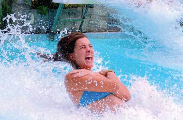 woman screams while splashing down slide at big kahunas water adventure park destin