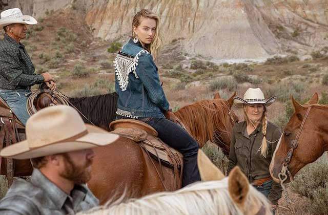 cowgirl on horseback with denim jacket at boot barn kissimmee