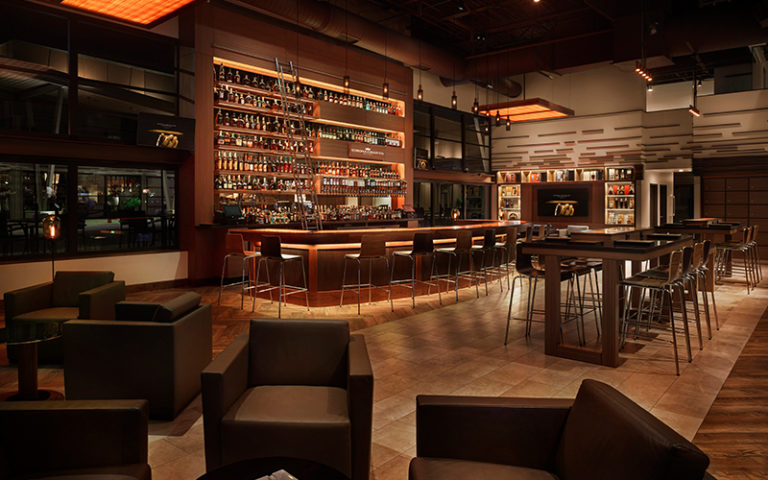 interior of lounge area with bar at corona cigar company tampa