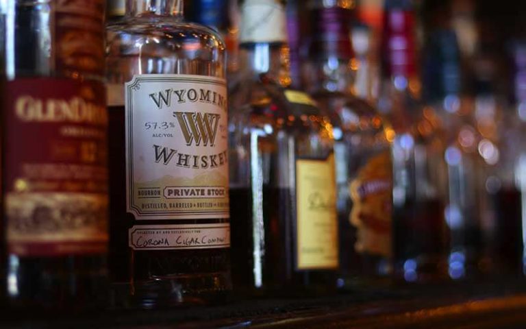 shelf with bottles of premium whiskeys at corona cigar orlando