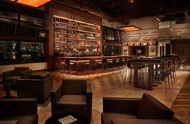 upscale lobby seating with full liquor bar and brown decor at corona cigar company tampa