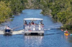 boats and a kayak on an inlet at flamingo adventures at everglades national park homestead