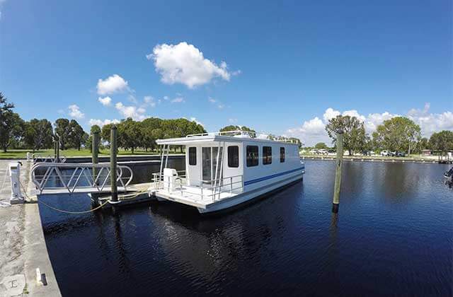 houseboat rental on a dock on an inlet at flamingo adventures at everglades national park homestead