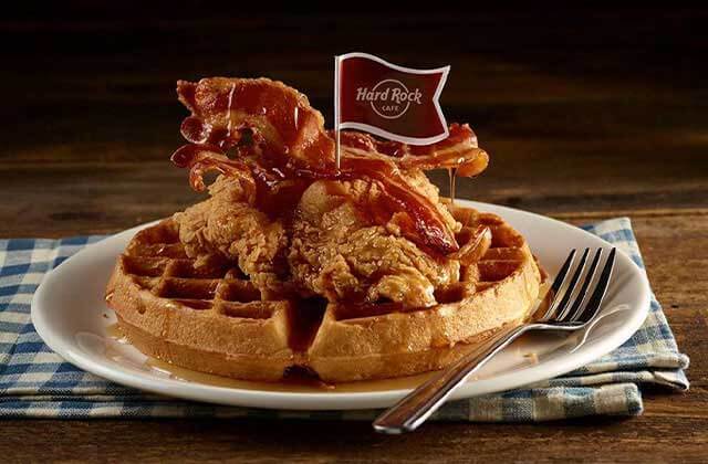 plate with waffles chicken and bacon with little flag logo at hard rock cafe florida