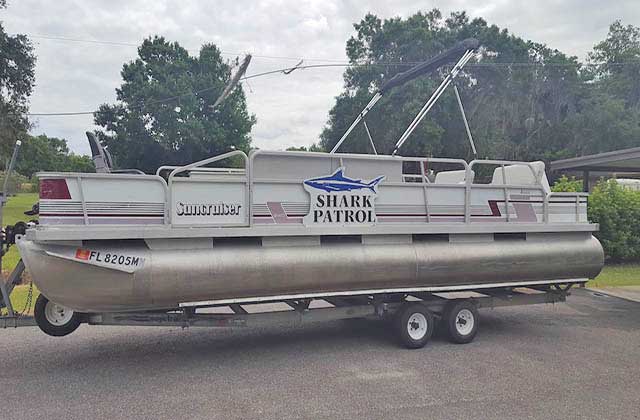 pontoon party boat on trailer with fishing rig at memory makin fishing guides kissimmee