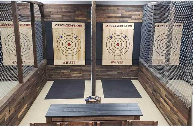 row of targets with fencing between at axe on axe off throwing venue orlando