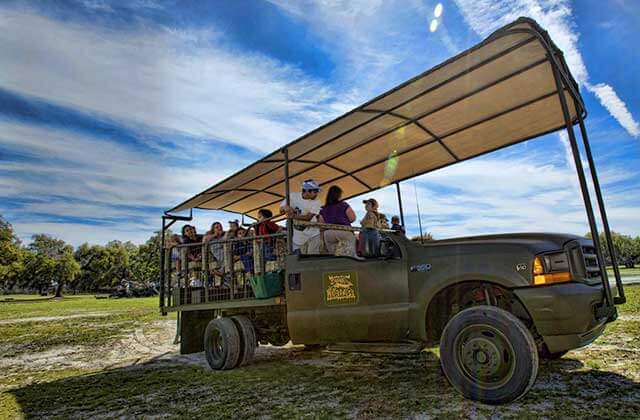tour group seated in a safari truck at safari wilderness ranch lakeland