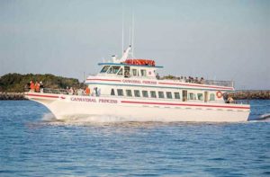 white and red deep sea fishing boat on inlet at princess fishing fleet cape canaveral