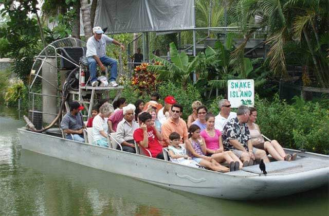 airboat with tourists in everglades at historic redland tropical trail