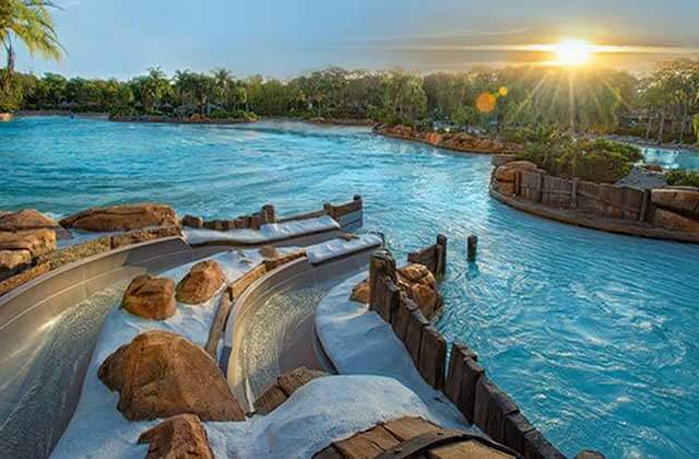 base of water slides with swimming areas and tropical landscaping at disneys blizzard beach water park