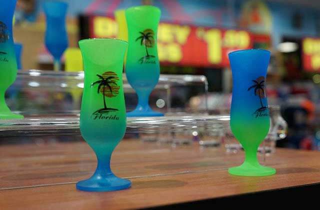 blue and green souvenir tulip shot glasses with palm tree and florida design at treasure island gift shop orlando lake buena vista