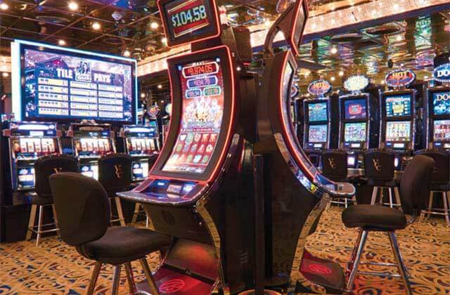 casino floor with slot machines and chairs at victory casino cruises port canaveral