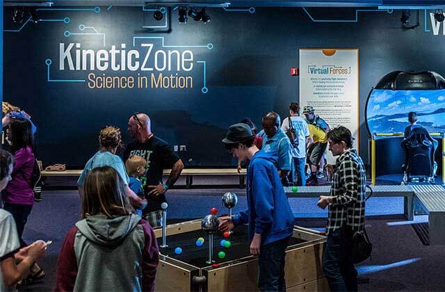 children interacting with several science exhibits at orlando science center