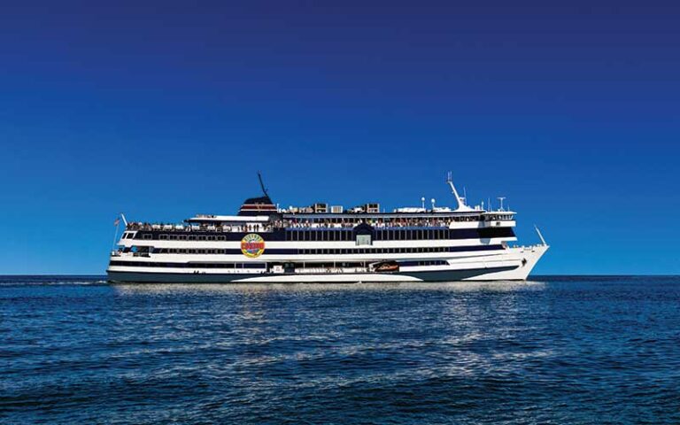 cruise ship with logo on blue ocean at victory casino cruises