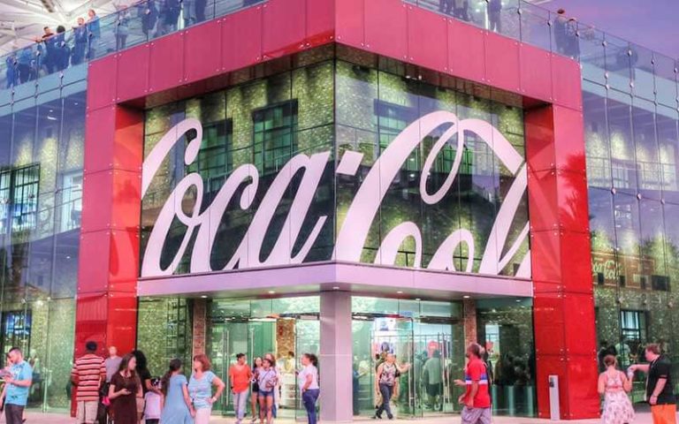 exterior front of coca cola store with logo and people at coca cola store at disney springs