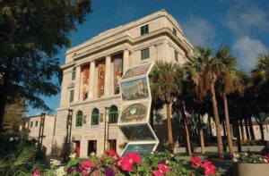 front exterior of downtown building with postcard art statue at orange county regional history center orlando