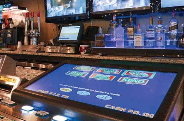 game screen along bar top with a full bar at victory casino cruises port canaveral