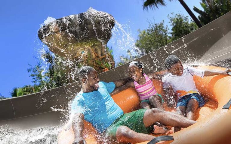 group on raft ride getting splashed miss adventure falls family raft at disneys typhoon lagoon water park walt disney world resort orlando