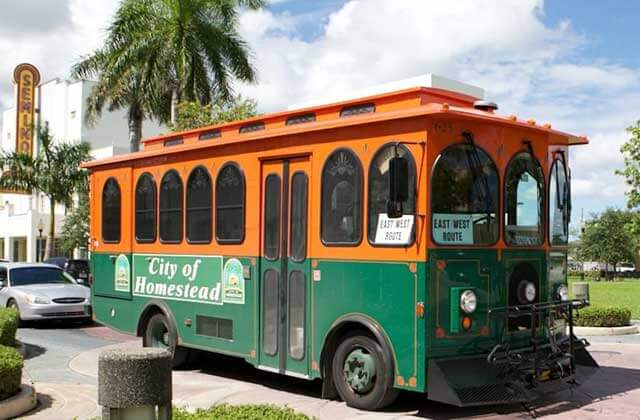 orange and green trolley at tropical everglades visitor center homestead