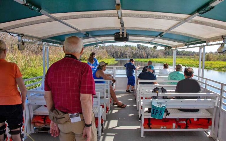 tour group on pontoon boat at blue spring adventures